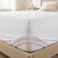 Deep-pocket skirt gripping the mattress corner